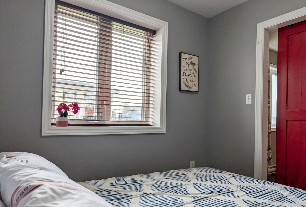 Main bedroom with queen bed and window