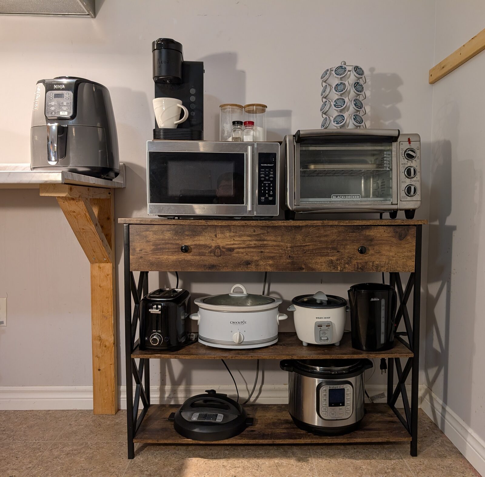 Kitchen appliances including microwave, toaster oven, and slow cooker